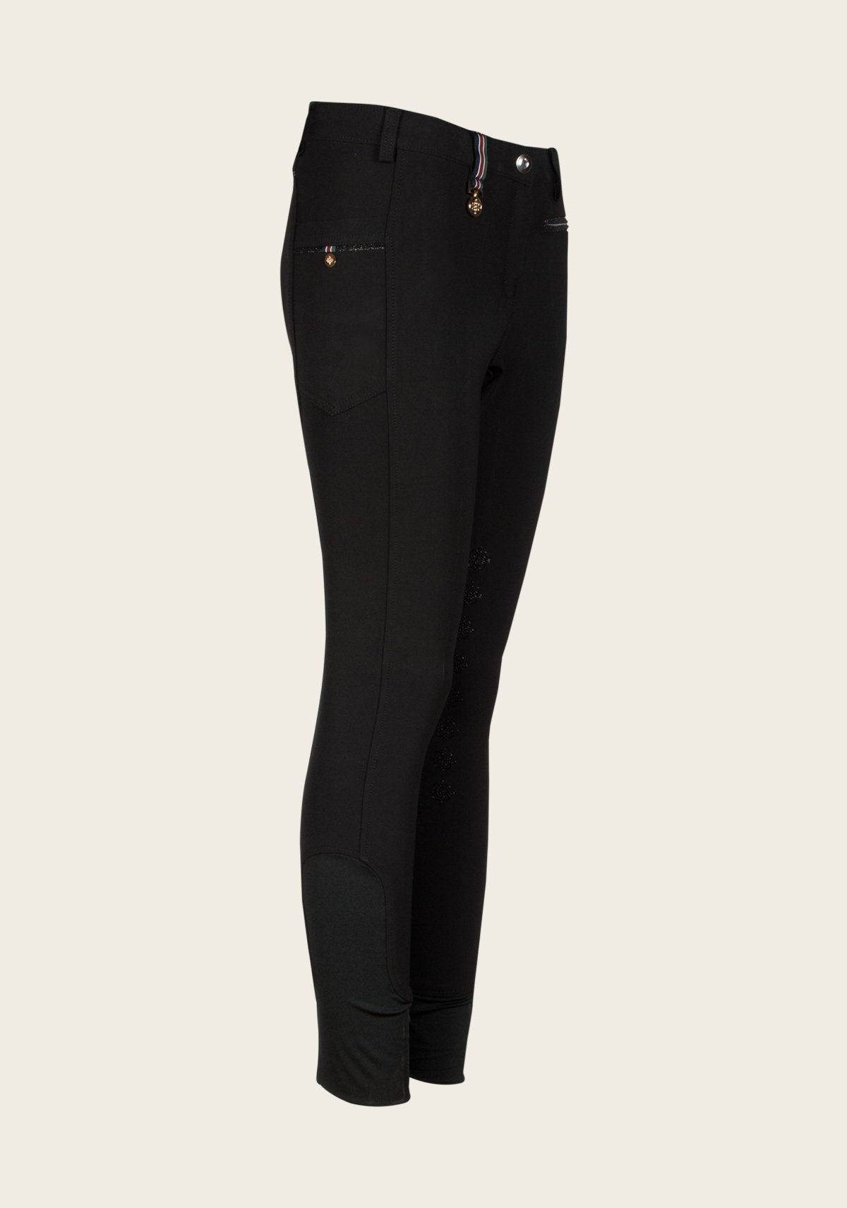 Side profile of Espoir Breech highlighting functional phone pocket with custom golden Espoir nameplate, ergonomic fit, and subtle glitter zip detail.