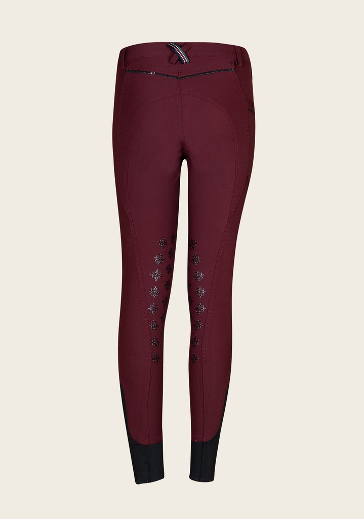 Back view of Espoir breech featuring signature crossed belt loop in Espoir colors and flattering stitch detailing