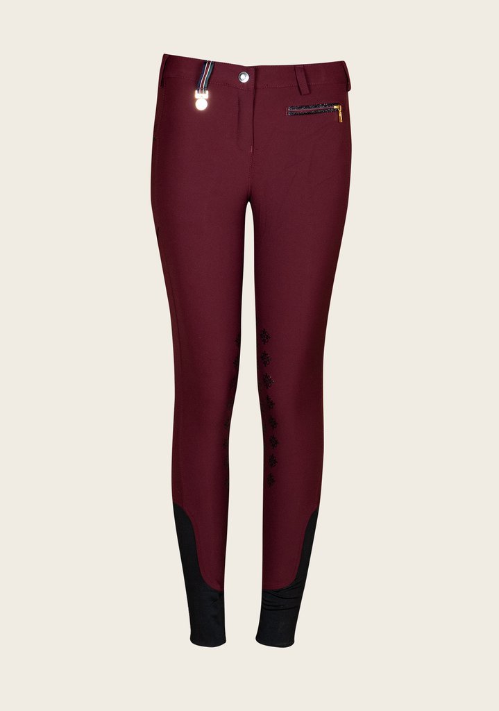 Front view of Espoir breech showing sleek fit, glitter zip pockets, and stretch fabric for riding comfort