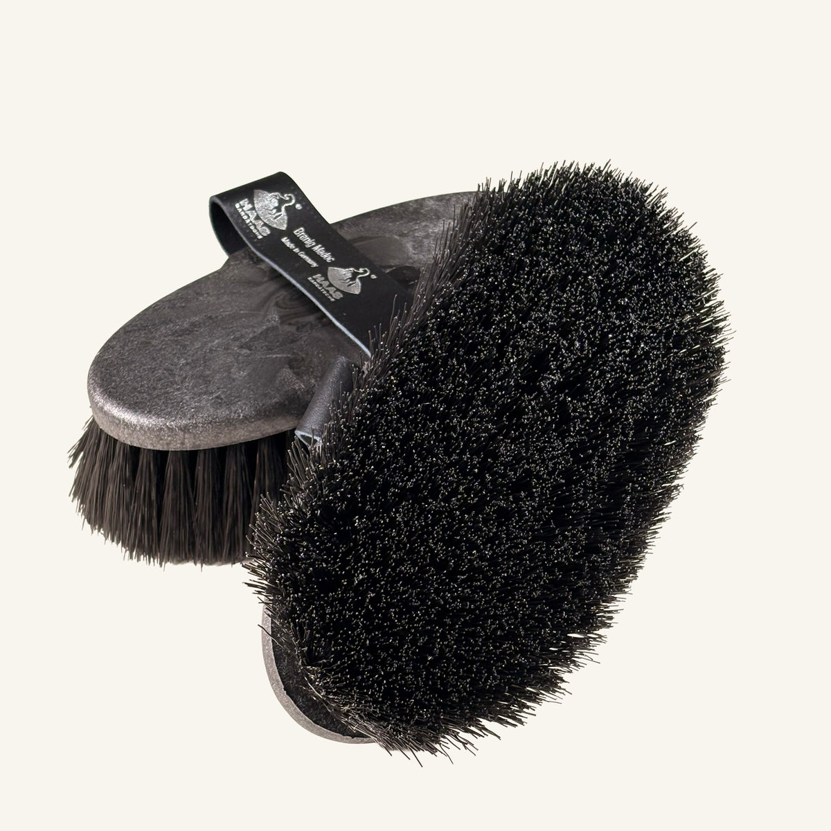 top and bottom view of the Haas Brenig Madoc brush XL in black