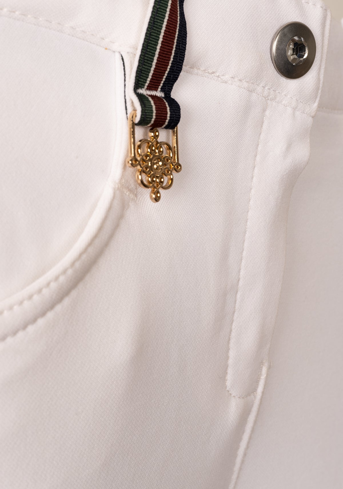 Close-up of Espoir Bamboo Breech golden fittings on belt area, showcasing premium hardware and subtle luxury detailing.