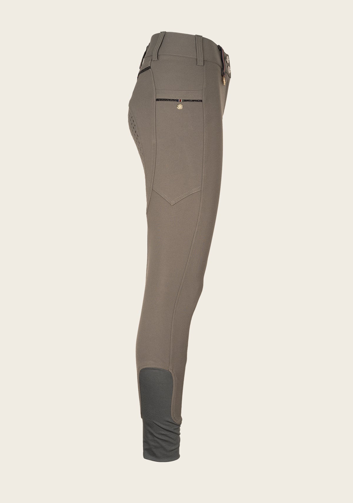 Side profile of Espoir breech highlighting phone pocket placement, ergonomic fit, and soft sock bottom.