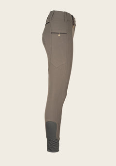 Side profile of Espoir breech highlighting phone pocket placement, ergonomic fit, and soft sock bottom.