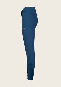 Side profile of Espoir breech highlighting phone pocket placement, contoured seams, and flexible riding fit.