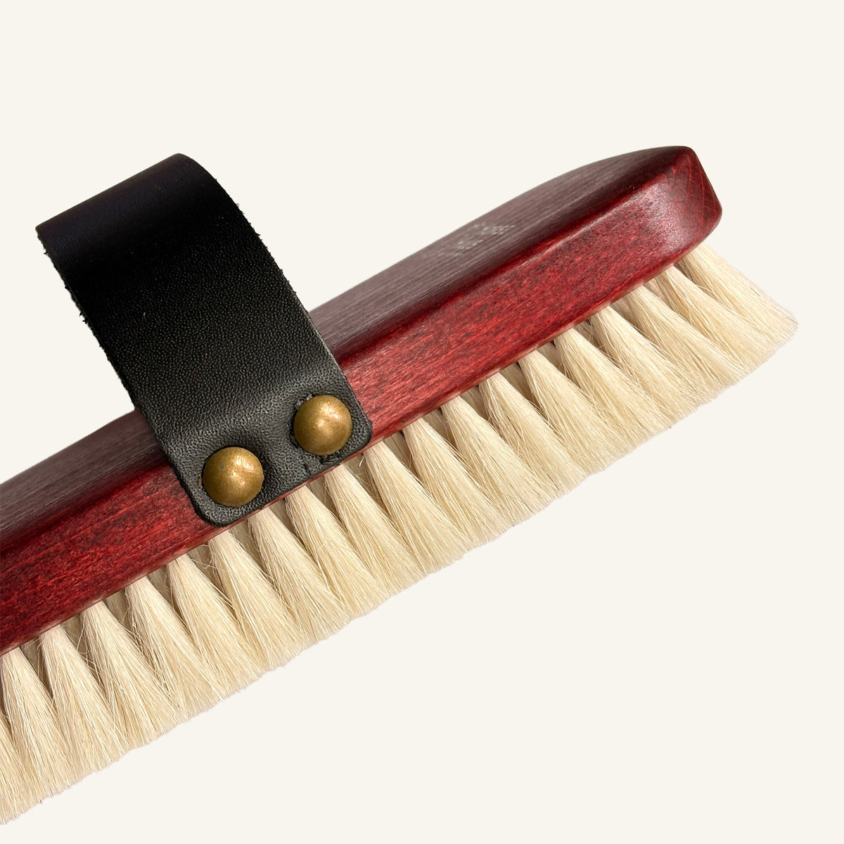 horsehaus gold horse finishing brush with goat hair detail view with leather strap