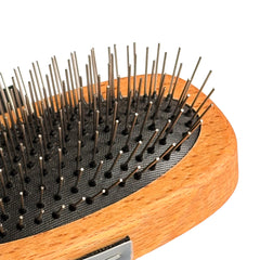 a detail view of the mane and tail brush "Urchin" by HorseHaus with visible stainless steel pins and durable rubber cushion